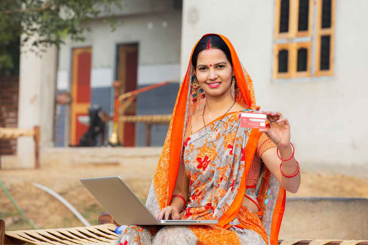 lady in saree showing some card