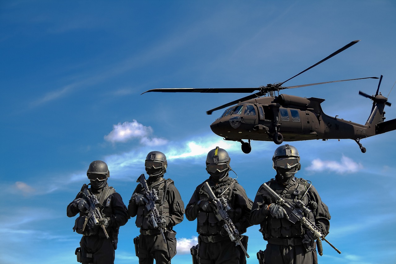 army officers with helicopter