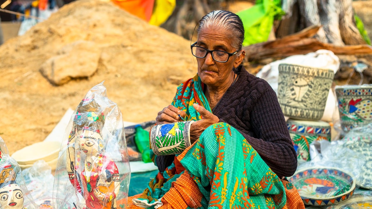 old lady is doing embroidery on a road