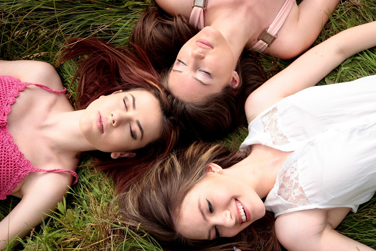 Girls lying on the grass